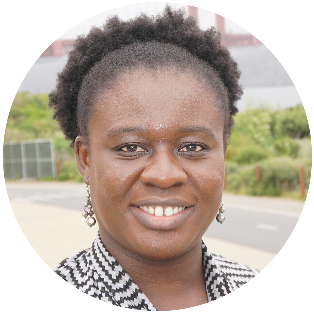 Headshot of PhD Research student Cynthia Klobodu in front of road and shrubs
